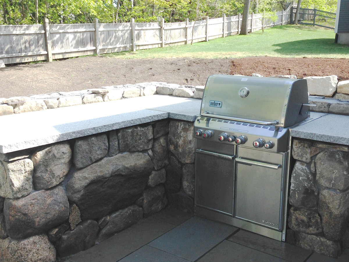 Slate Patio with Stone Wall and Built-in Grill